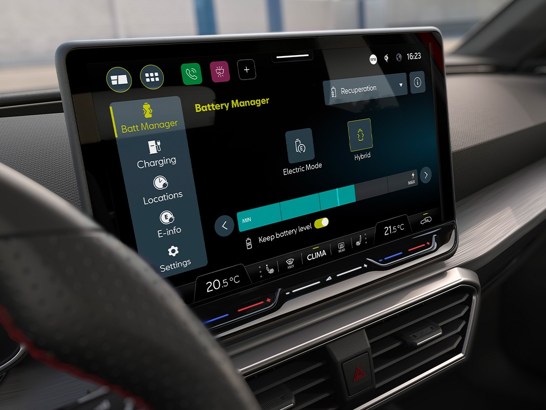: Interior view of the SEAT Leon's digital dashboard, compatible with wireless apple carplay and carplay android auto, allong with lane assist and advanced driving aids.