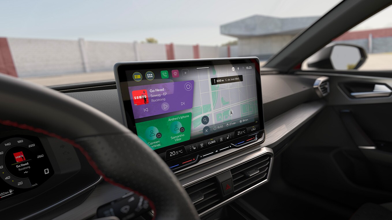 Interior of the SEAT Leon showcasing a glimpse of the steering and its full dynamic dashboard touchscreen to enjoy full control while driving.