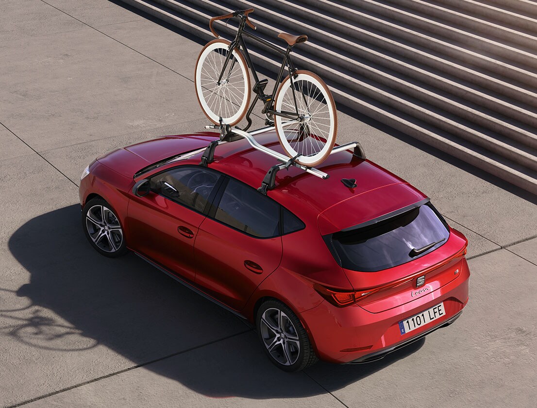 Red SEAT Leon equipped with a bike rack, perfect for carrying your 2-wheel ride and exploring new adventures. Ideal for five door models in the range.