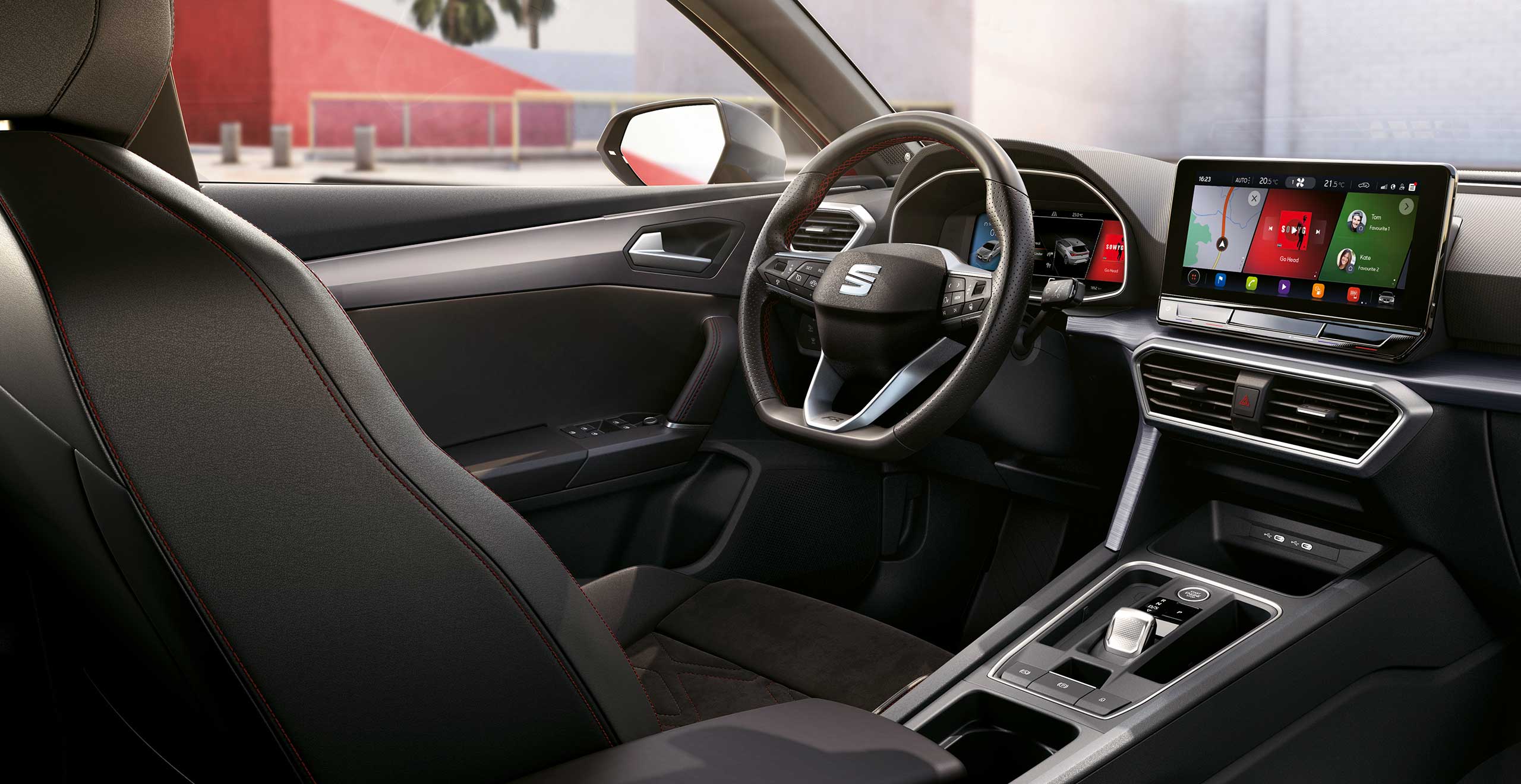 SEAT Leon interior view with steering wheel and infotainment screen 